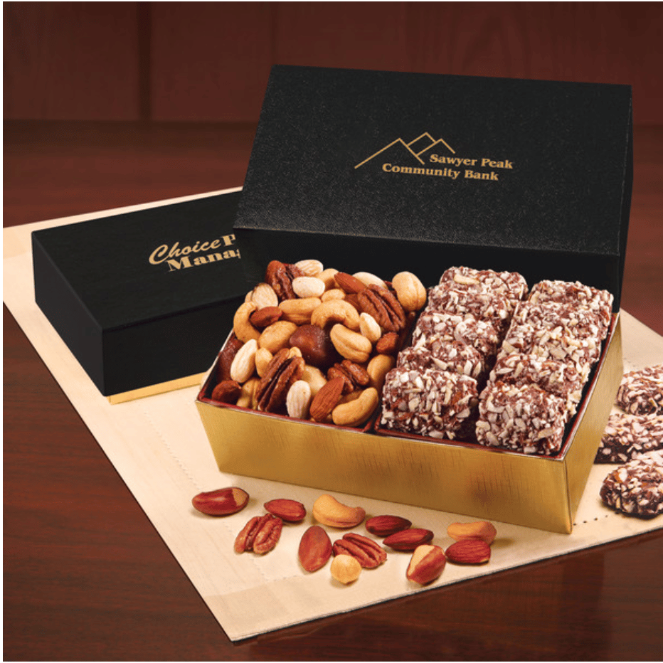 An open gift box showing 12 pieces of english butter toffee and a selection of mixed nuts.