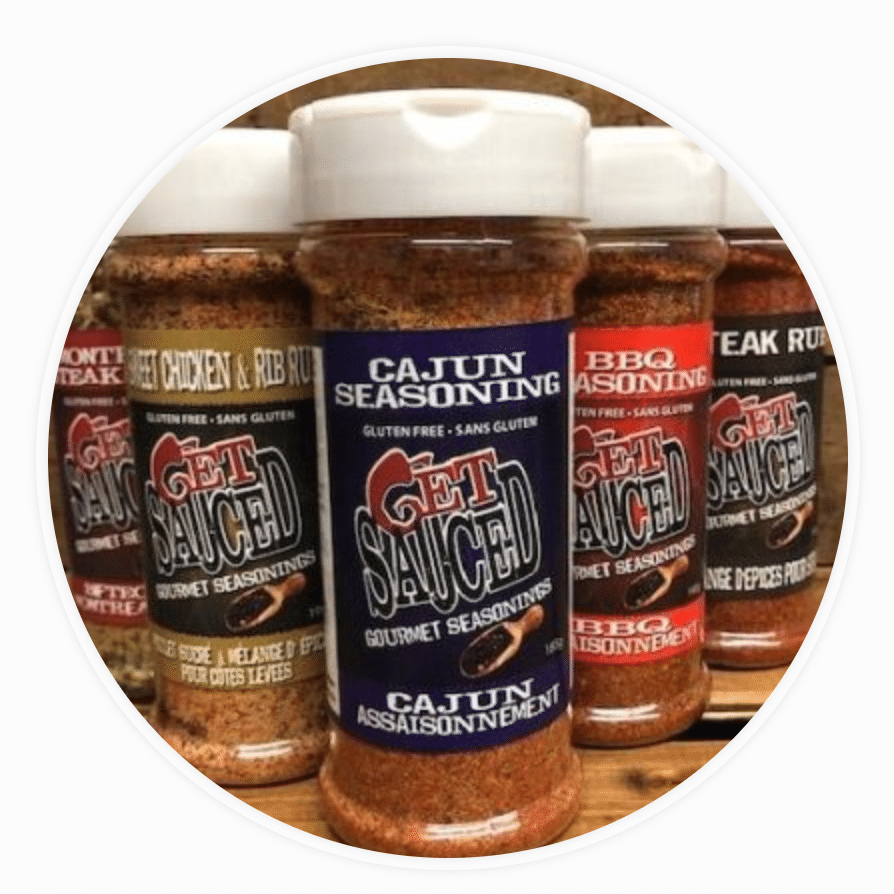 A selection of custom branded spice shakers for kitchen cooking or the BBQ.
