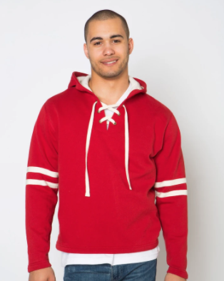 A man wearing a custom red hoodie with white trim and full sleeves. The neck has an open v-neck with white laces crossing like a pair of skate laces.