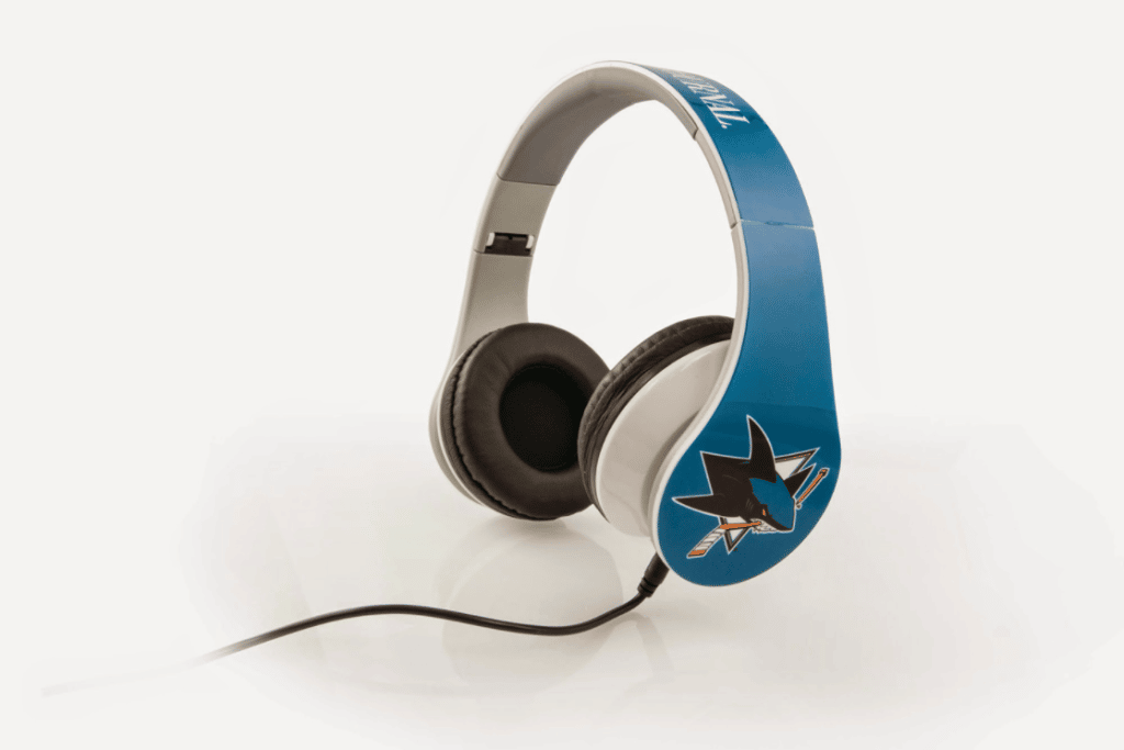 Custom headphones with an all over print of teal and an image of the San Jose Sharks hockey team logo on each ear.