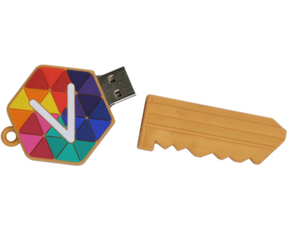 A computer USB flash storage drive in the custom shape of a house key that pulls art to reveal the USB end.