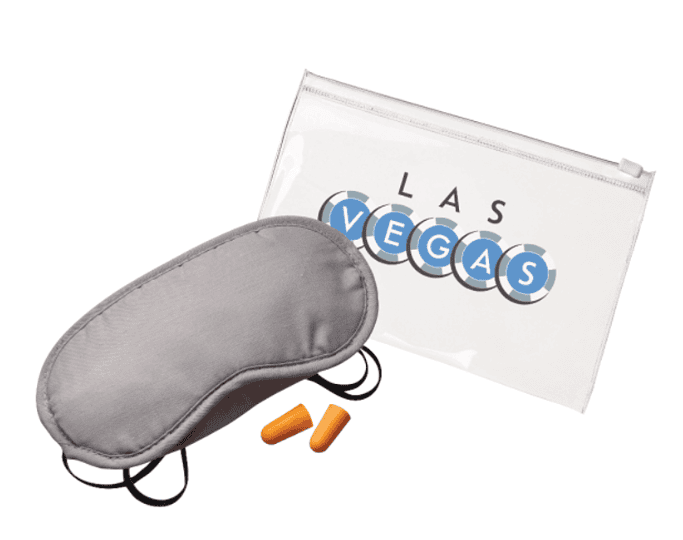 An eye mask, two earplugs and a plastic bag.