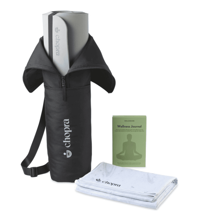 Screenshot of a yoga mat in a bag, a towel and a journal.
