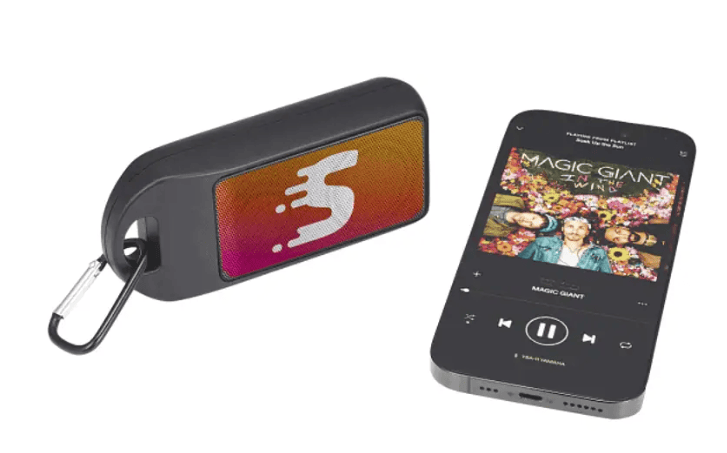A small speaker and a phone.