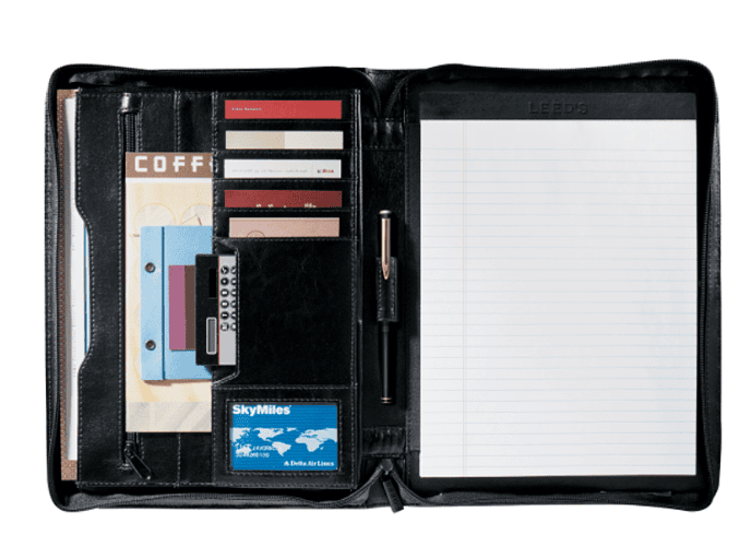 A padfolio with a notepad, business cards, a calculator, a pen and documents inside.