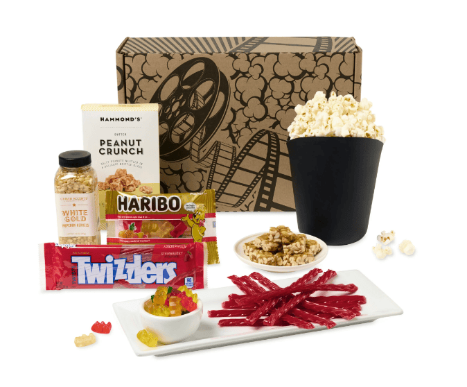 SwagDrop Pop Culture Gourmet Gift Set with premium snacks and a mini popcorn bowl, ideal for cozy movie nights.