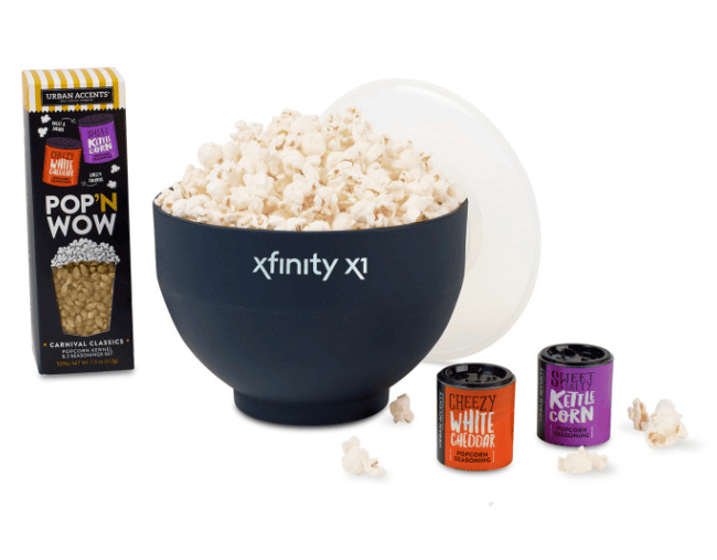 SwagDrop What’s Pop’N Gourmet Popcorn Gift Set, including a popcorn box, seasonings, and a silicone bowl with a lid, ideal for movie nights.