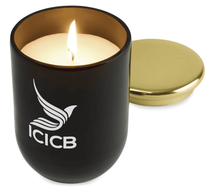  Screenshot of a lit candle in a black candle holder.
