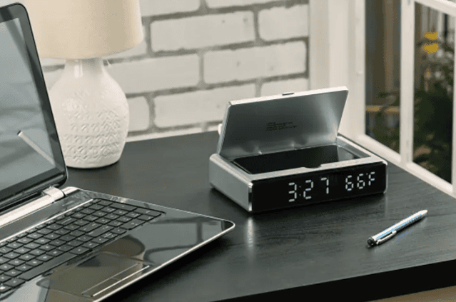 SwagDrop UV Sanitizer Desk Clock with Wireless Charging in silver, that combines modern timekeeping with tech-friendly convenience.