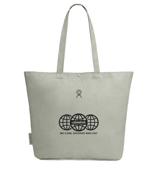 SwagDrop Hydro Flask Tag Along Tote, in cream, folding into a small bundle and using recycled fabric for eco-friendly errands or picnics.