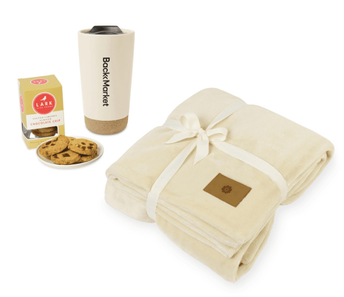 SwagDrop Wrapped In Comfort Gift Set, featuring a tumbler, a throw blanket, and tasty cookies for a relaxing IWD celebration at home.